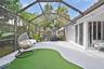 Screened patio offering flexible indoor-outdoor living with potential to expand