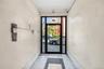 Entryway featuring crown molding