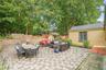 The back of the home is a custom, oversized patio offering maintenance free living.