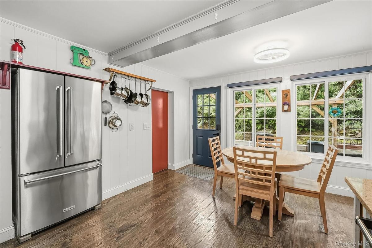 The kitchen overlooks the private backyard with a spacious custom patio.