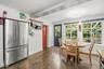 The kitchen overlooks the private backyard with a spacious custom patio.