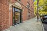 Property entrance featuring brick siding
