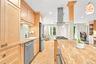 Long granite expanse is perfect for food prepping as you greet guests and family