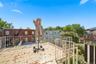 Rear balcony looking toward the backyard. Digitally decluttered.