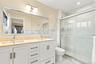 Primary ensuite bathroom with double sink vanity.
