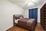 Unit 1 - Bedroom 2. Virtually staged and digitally decluttered.