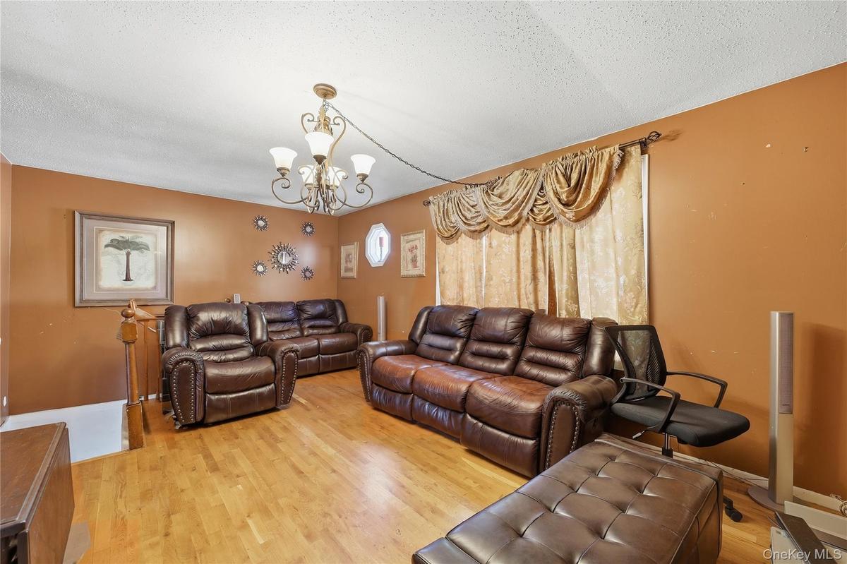 Unit 2 - Duplex living room. Digitally decluttered; some decor restyled.