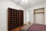 Unit 1 - Bedroom 2, storage and hallway view. Virtually staged and digitally decluttered.