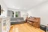 Generously proportioned 2nd bedroom easily transforms into second TV room/Den, Music Room.