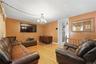 Unit 2 - Duplex living room, reverse view. Digitally decluttered; some decor restyled.