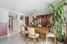 Unit 2 - Dining and family area, reverse view. Virtually staged and digitally decluttered.