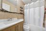 Unit 1 - Bathroom with bathtub. Digitally decluttered.