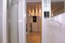 Basement bathroom with tile shower enclosure with frosted glass door