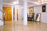 Light-toned tile flooring throughout basement