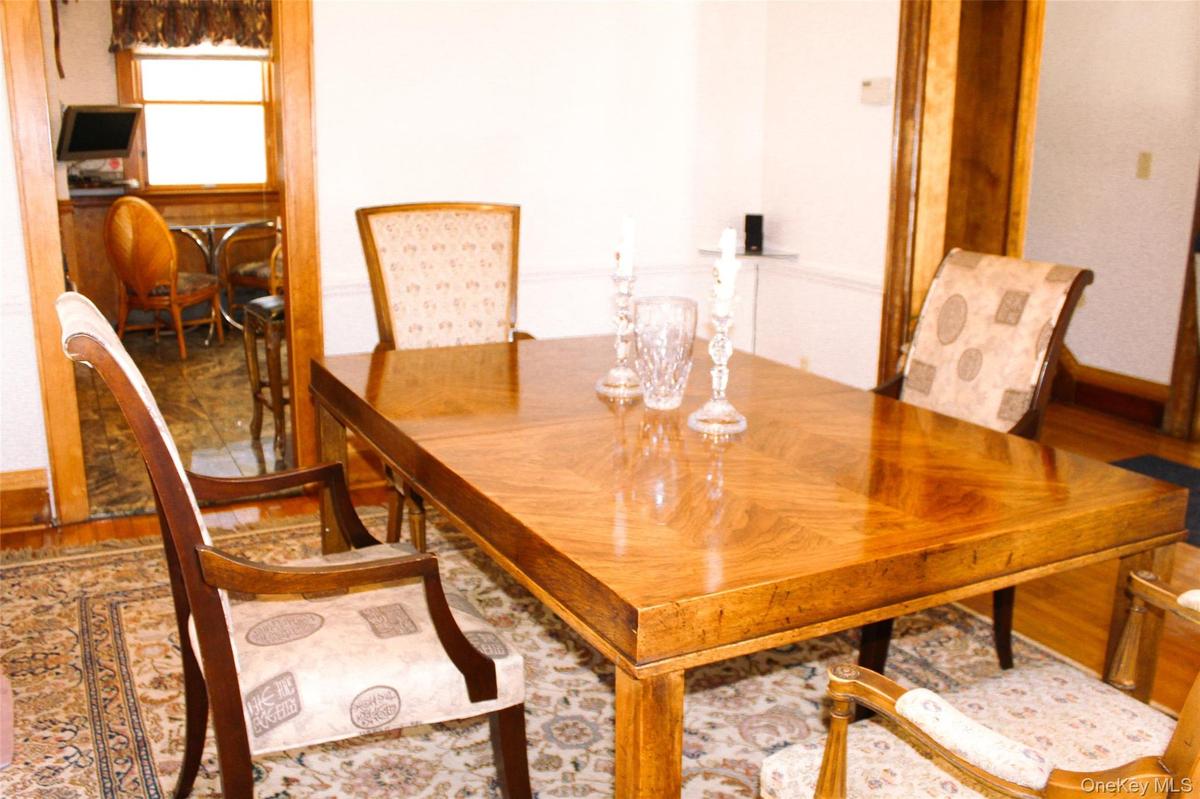 Formal Dining Room with Hardwood flooring, and wood trim accents