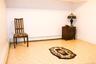 Recessed lighting illuminating a spacious room with   hard-surface flooring and closet