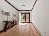 Spacious living room opens to dining room. with glass doors to rear deck