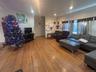 Living room with hardwood / wood-style floors and recessed lighting