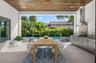 Virtually staged, paradise awaits in the under roof outdoor entertaining area with built in luxury kitchen.