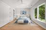 Virtually staged first floor additional bedroom suite offering privacy, comfort, and additional full bathroom.