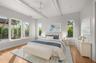 Virtually staged primary suite featuring elevated custom trim and refined architectural detailing.