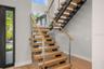 Custom designed staircase leading to second floor leading to 3 additional en suite bedrooms.