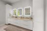 Virtually staged primary bath designed as a serene, spa-inspired retreat with luxurious finishes.