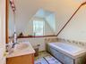 Second bathroom upstairs with jetted tub.