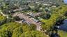 Lake Tarpon Lodge connected to the RV lot & boat ramp by an open dock & fishing pier~
