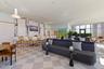 An airy gathering space where indoor comfort flows naturally toward the terrace.