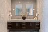 Dual vanities, marble surfaces, and elevated detail create a true retreat.