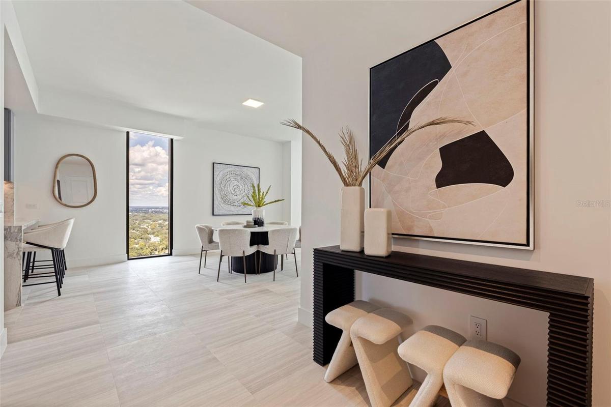 A refined entry unfolds into light-filled living and sweeping views.