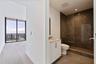 Bedroom 2: A private guest suite with its own en-suite bath and balcony access—comfort that feels considered.