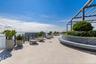 Generous rooftop seating invites residents to slow down and take in the view.