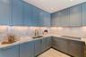 Italian ItalKraft cabinetry, marble surfaces and warm under-cabinet illumination.
