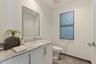 A polished powder bath adds a refined touch for guests.