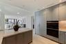 A chef-caliber kitchen with Sub-Zero and Wolf appliances, island wine refrigeration, and under-sink water purification.