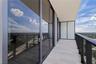 An expansive private balcony opens the home to sweeping views and fresh air high above Tampa.