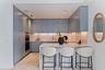 The signature Ritz-Carlton blue kitchen, finished with marble and bespoke detail.