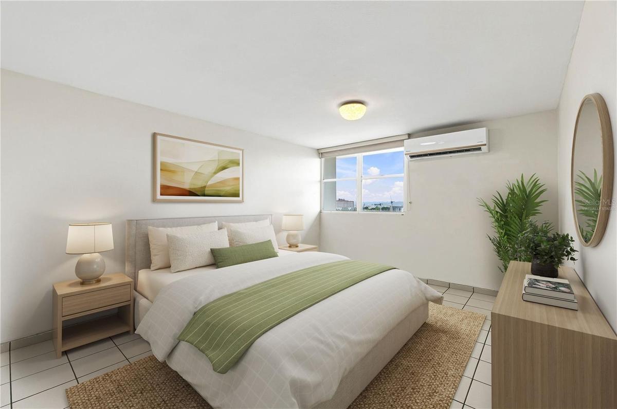 Primary Bedroom - This image has been virtually staged and does not reflect the current state of the property.