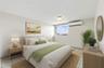 Primary Bedroom - This image has been virtually staged and does not reflect the current state of the property.