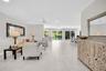 Light & bright upon entry with direct pool views~
