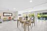 The perfect living/dining room combo with direct pool views through 3 massive glass sliders~