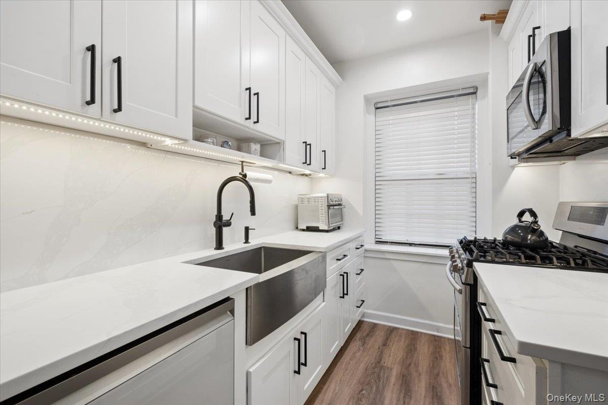 Newly Renovated Kitchen w/ White Cabinetry, Stainless Steel Appliances.
