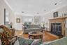 Living room with wood burning fireplace