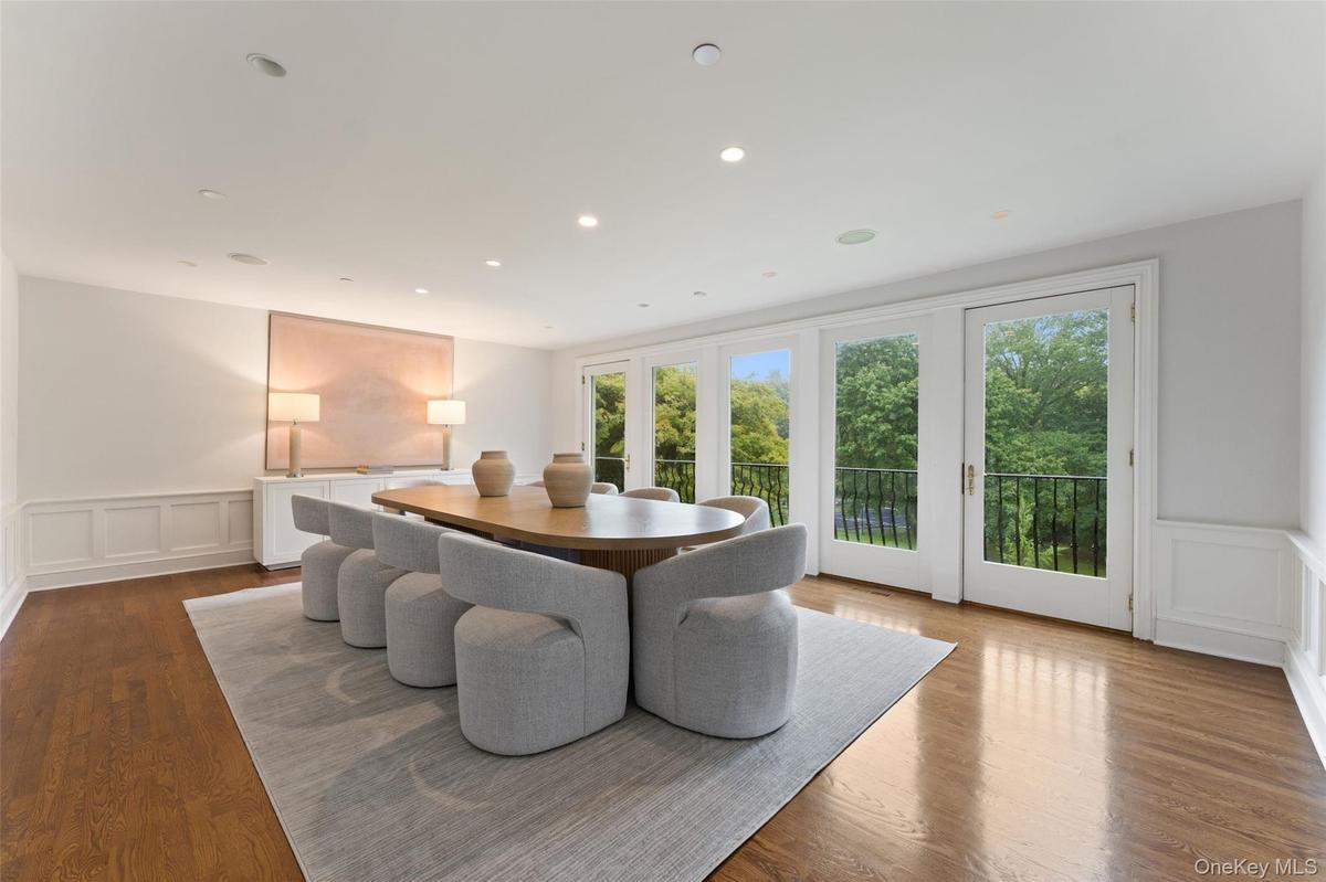 Dining Room with wall of windows overlooking the magnificient grounds