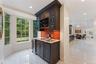 Wet Bar adjacent to the dining room and kitchen