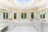 Primary bathroom with 2 vanities and soaking tub