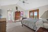 Vaulted ceilings in this lovely primary suite with Juliet balcony
