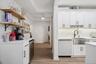 Beverage Center is on the left w/ Open Shelves and Built-in Wine Fridge